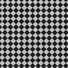 Seamless pattern of alternating black and grey diamonds arranged in a checkerboard style, creating a geometric and repetitive background.