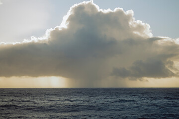 Fototapeta premium incredible views of the ocean, mountains, and black sand at sunset