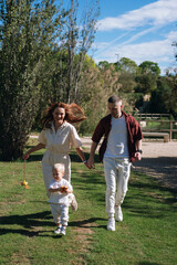Family enjoying happy playtime in green park