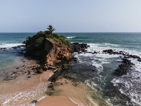 Parrot Rock Bridge connecting small island to beach in Mirissa, Sri Lanka