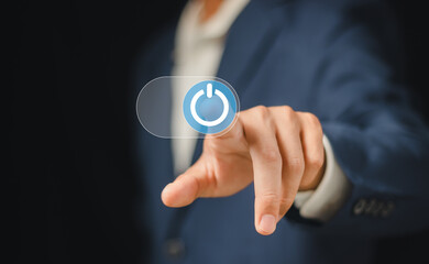 businessman pressing power button. Start or shut down concept.