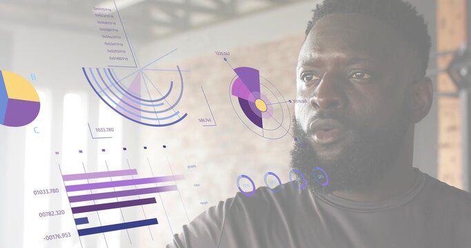 Reaching man wearing dark athletic tee interacting with AR data overlays in gym loft, copy space - Powered by Adobe