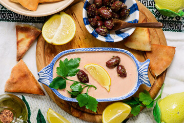 Taramasalata, a traditional Greek meze appetizer made with fish roe and pita bread.