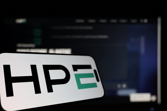 Kiel, Germany - 01-12-2026: Smartphone displaying HPE logo in front of the company website on a monitor