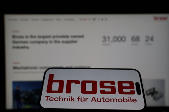 Kiel, Germany - 01-12-2026: Smartphone displaying Brose Group logo in front of the company website on a monitor