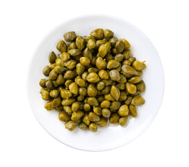 pickled capers in a white ceramic bowl isolated on a white background, top view.