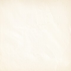 Fototapeta premium A weathered white wall featuring several visible cracks, showcasing signs of age and wear, with subtle shadows enhancing its textured surface.