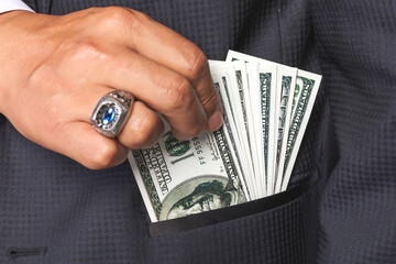 Businessman with Cash in Pocket - Bribery and Corruption Concept