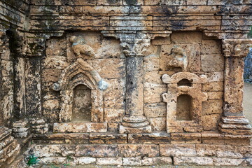 View of ancient stone carvings, weathered textures, and architectural details evoke history and artistry, showcasing craftsmanship, Taxila, Punjab, Pakistan.