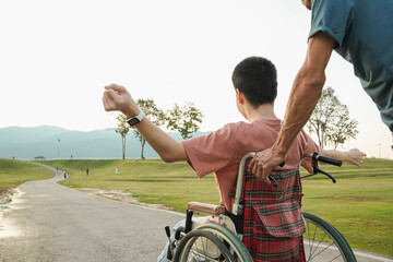 A joyful outdoor lifestyle moment of a young wheelchair user enjoying fresh air in a park with supportive family. Natural light scene expressing freedom, confidence, and inclusive everyday living.