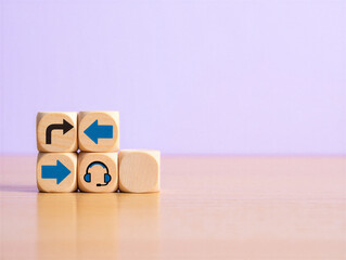 Wooden blocks with arrows and headset icons on a light purple background and wooden surface with reflections