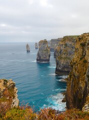 Coastal cliffs, dramatic rock formations, turquoise water