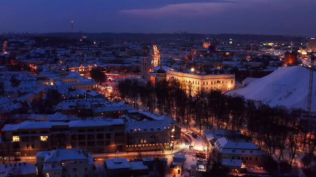 Vilnius, Lithuania &mdash; January 13, 2026. Aerial view of downtown Vilnius at night with illuminated streets and city lights.