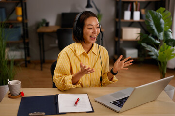Woman presenting ideas and working during an online video conference from home office