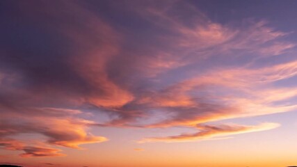 Dynamic sunset sky showcasing swirling pink and orange clouds against a deep purple-blue - Powered by Adobe