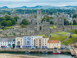 Aerial view of St Andrews a town on the east coast of Fife in Scotland. St Andrews Cathedral and castle, view of the coast and its green areas