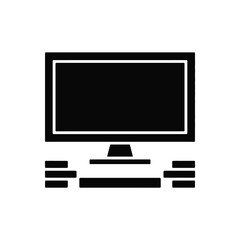 a black and white icon of a computer monitor on a desk