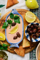 Taramasalata, a traditional Greek meze appetizer made with fish roe and pita bread.