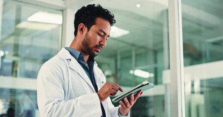 Doctor, man and reading in office with tablet for health insurance info, medical research or report. Healthcare worker, person or scroll with digital tech in clinic for telehealth, website or review. - Powered by Adobe