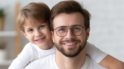 Father and son smiling together in a bright indoor space during daytime