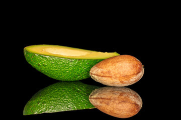 Ripe avocado isolated on black background, close-up.