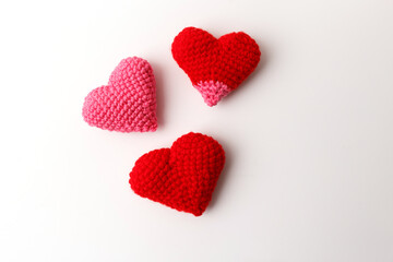 Knitted stuffed heart toys red pink color yarn texture handicraft art for toy stores textile...