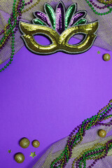 Mardi Gras vertical background with colorful mask and beads creating a festive atmosphere