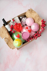 Seasonal gift box idea for Valentine's day, 14 february. basket with body care cosmetic products, presents. Beauty themed personalized box, spa set for family, friends, woman. top view. copy space