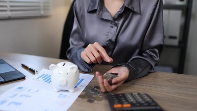 Person inserting coin into piggy bank, symbolizing saving, investment, financial growth, security, future planning, wealth, banking, and smart money management.
