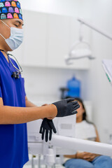 Dentist preparing for a dental procedure in clinic