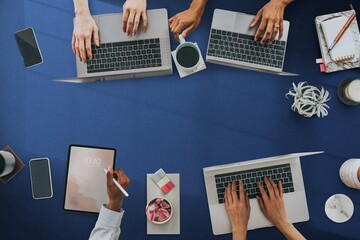 Businesswomen using digital devices at work