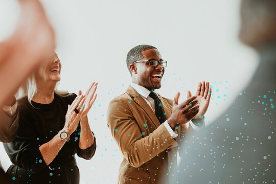 Diverse business people applauding with joy