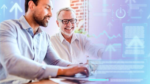Cheerful web developers working on a laptop - Powered by Adobe