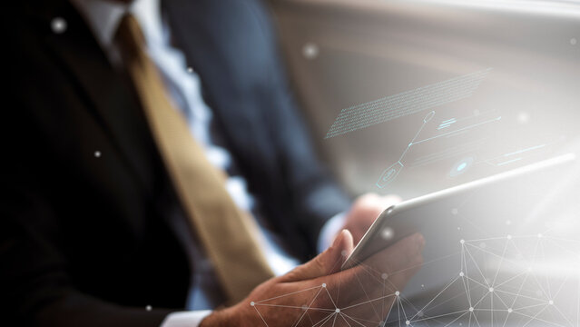 Businessman using digital tablet technology - Powered by Adobe