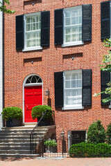 Editorial view of city home entrance with autumn decoration in Washington DC