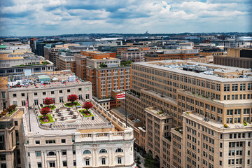 panoramic, bird's-eye view of downtown Washington, D.C., with its dense urban development and building rooftops.