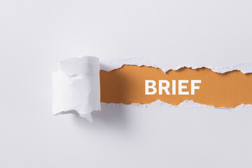 torn paper with brief word