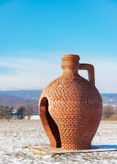 big jug statue build from red bricks