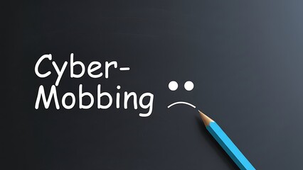 Text 'Cyber-Mobbing' with sad face drawn on blackboard, blue pencil creating mouth, concept of online bullying and harassment