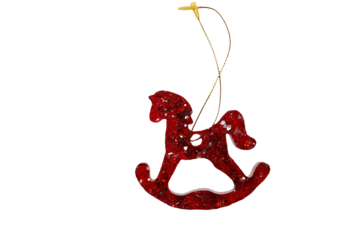 A red rocking horse ornament hangs from a string