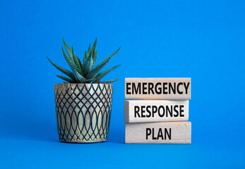 Emergency Response Plan symbol. Concept words Emergency Response Plan on wooden blocks. Businessman hand. Beautiful blue background with succulent. Business concept. Copy space.