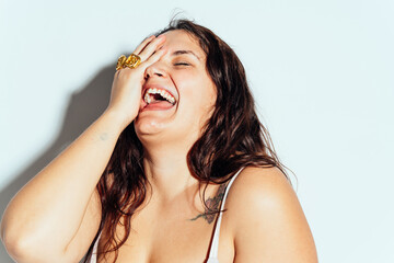 Plus size woman posing in studio in lingerie