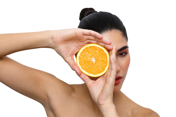 Woman holding orange slice for vitamin c skin beauty