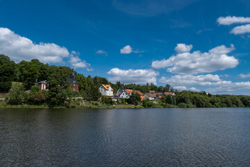 Vibrant Houses By Tranquil Water, Charming Lakeside Community With Colorful Homes And Serene Reflections