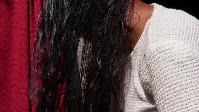 Women drying hair with a cloth microfiber or soft cotton cloth