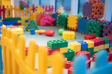 Playground with colorful plastic toys Lego. Children love to play and imagine. Great place for interesting activities at home, entertainment center or kindergarten. Nobody. © Vera