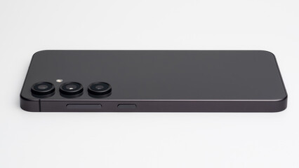 Modern dark gray smartphone with triple camera lenses on a clean white background