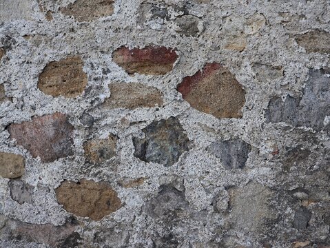 Old stone wall texture with rough surface and natural pattern. weathered masonry background with rocks and cement, rustic and urban wall detail. - Powered by Adobe