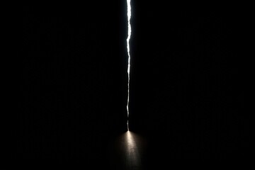 Light Crack: A Glimmer of Hope Breaking Through the Darkness Concept