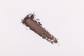 A straight long sample of brown dry eye shadow or dark compact powder. decorative cosmetics template. top view. A copy space. Shadow texture template.